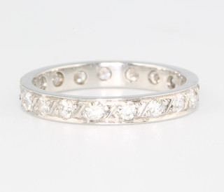 A platinum and 18ct white gold diamond eternity ring size L