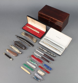 A gold plated Parker 51 propelling pencil cased, a propelling pencil, a brushed steel ballpoint pen, a Parker pen and propelling pencil, pocket knives etc
