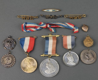 A silver sports fob and minor commemorative medallions