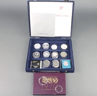 Seven silver commemorative Olympic medallions, a dollar and minor cased coins, weighable silver 216 grams
