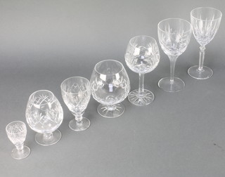 A suite of table glassware comprising 5 wines, 5 large wines, 4 brandy, 3 liqueurs, 6 sherry glasses, 6 hocks and 2 small brandies