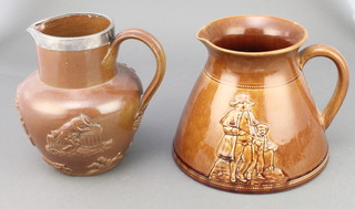 A Bretby brown glazed jug decorated Oliver and The Beadle 6" together with a stoneware harvest jug with plated lip 