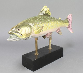 A ceramic figure of a polychrome trout raised on a black socle 18" 