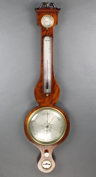 A 19th Century mercury wheel barometer and thermometer with 8" silvered dial, damp/dry indicator, thermometer and spirit level, contained in an inlaid mahogany wheel case 
