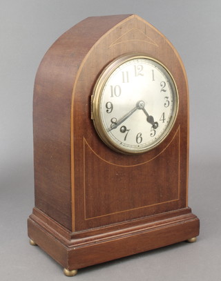 A striking mantel clock with silvered dial and Arabic numerals contained in an inlaid mahogany lancet case 
