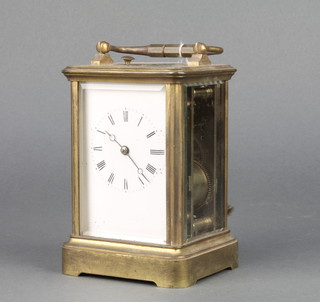 A 19th Century French 8 day striking carriage clock with enamelled dial and Roman numerals contained in a gilt metal case, the back plate marked 6380 4 1/2"h x 3"w x 2 1/2"d  