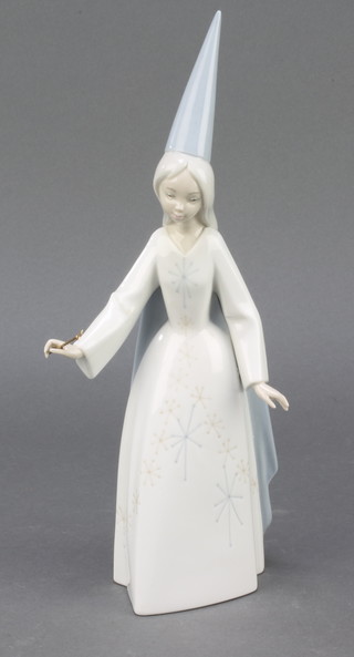 A Lladro figure of a white witch 11"
