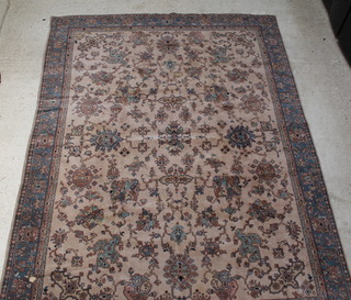 A brown ground Anatolian rug with floral decoration 143" x 106" 