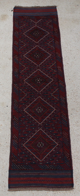 A Meshwani red and blue ground runner with 5 stylised octagons to the centre 97" x 24" 