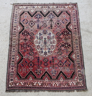 A pink and white ground Persian rug with central medallion 67" x 50" 
