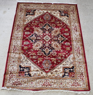 A red and gold ground Heriz rug with central medallion 110" x 80" 