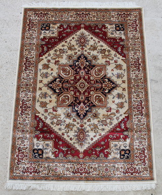 A gold and red ground Kejhan style Belgian cotton rug with central medallion 75 1/2" x 53" 