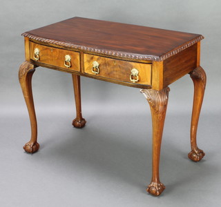 A Chippendale style mahogany bow front side table with gadrooned border, fitted 2 drawers with brass lion mask drop handles raised on cabriole supports 30"h x 35"w x 20"d 