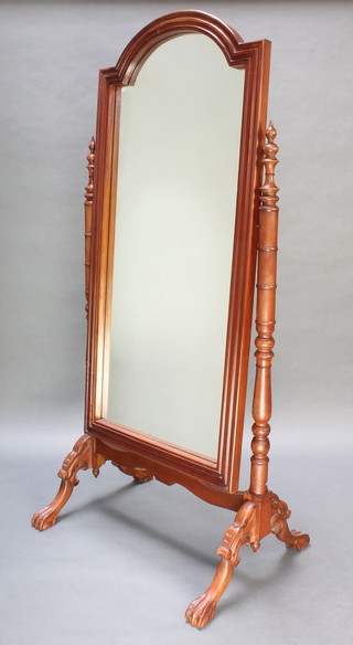 A Victorian style arched bevelled plate cheval mirror in a mahogany swing frame 70" x 32" 