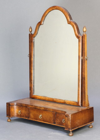 A Queen Anne style arch plate dressing table mirror contained in a walnut swing frame, the concave shaped base fitted 1 long and 2 short drawers raised on bun feet 31"h x 22"w x 9 1/2"d 