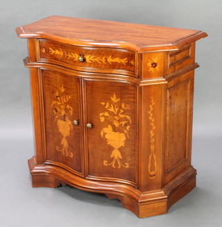 A French style marquetry cabinet of serpentine outline fitted 1 long drawer above a cupboard enclosed by panelled doors, raised on bracket feet 33 1/2" x 37 1/2" x 18"