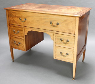 An 19th Century rectangular mahogany enclosed wash stand in the form of a writing table with inset tooled leather writing surface, the base fitted 4 short drawers raised on square tapered supports 33" x 42" x  22" 