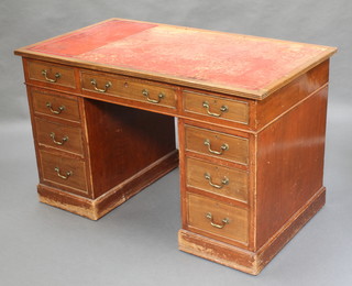 A mahogany kneeholed pedestal desk with inset tooled leather writing surface above 1 long and 8 short drawers with brass swan neck drop handles 29"h x 48"w x 27"d 