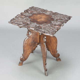 A square Indian carved and pierced hardwood table raised on a folding stand 20" x 17 1/2" x 17 1/2" 