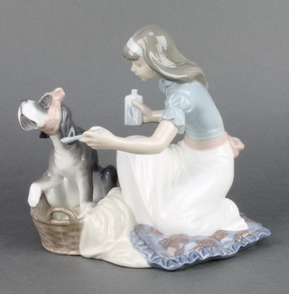 A Lladro group of a girl nursing a poorly hound 5921 7" 