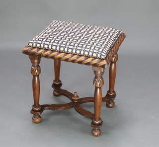 A Victorian square oak stool with Berlin woolwork seat and rope edge decoration, raised on turned supports with X framed stretcher 20" x 19" x 17"