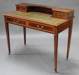 Heales & Sons, an Edwardian inlaid mahogany writing table with raised superstructure to the back fitted drawers, having a green inset writing surface above 2 long drawers, raised on square tapering supports brass caps and castors 34"h x 42"w x 21 1/2"d 
