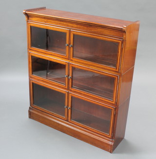 An Edwardian inlaid mahogany Globe Wernicke style 3 tier bookcase enclosed by panelled doors 40"h x 35"w x 10"d 