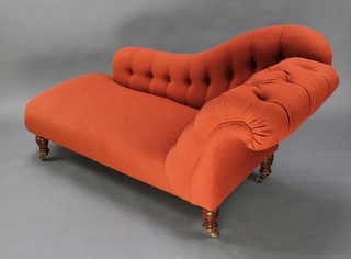 A Victorian chaise longue upholstered in buttoned rust coloured material raised on turned supports 32"h x 64"w x 25" 