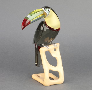 A Swarovski coloured Crystal figure of a Toucan sitting on a wooden stand 8"  boxed