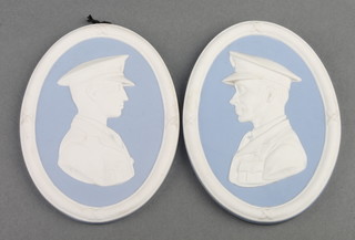 A pair of Wedgwood blue Jasper commemorative plaques Arthur Whitten Brown 1886-1948 and Sir John William Alcock DSC 1892-1919 4 1/2" x 3 1/2"  