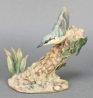 A Border Fine Arts figure of a kingfisher on a branch by Geerty 8" 