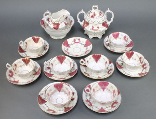 A 19th Century Rockingham style tea set comprising sugar bowl with lid, cream jug, slop bowl, 8 tea cups and 9 saucers 