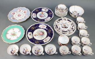 A Rockingham style part tea set comprising 5 tea cups, 8 coffee cups, a slop bowl, 8 saucers, 3 plates together with 4 19th Century dessert plates and a cup 