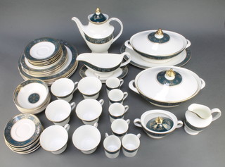 A Royal Doulton Carlyle pattern coffee, tea and dinner service comprising 6 coffee cans, 6 tea cups, 6 small saucers, 5 large saucers, 6 side plates, 6 dinner plates, a teapot and lid, 2 oval tureens and covers, a sauce boat, milk jug, sugar bowl and oval serving plate 