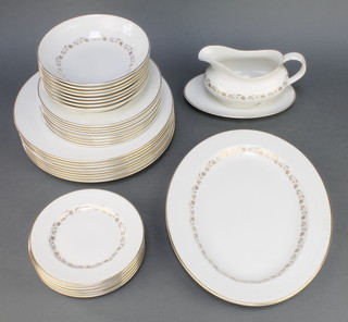 A Royal Doulton Fairfax pattern part dinner service comprising 8 small plates,  8 medium plates, 8 dinner plates, 8 dessert bowls, sauce boat and stand and oval serving plate