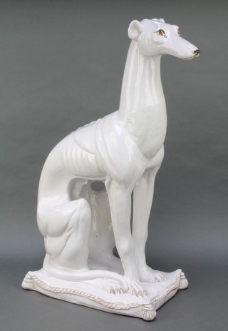 A 20th Century Italian model of a seated hound raised on a cushion 26" 