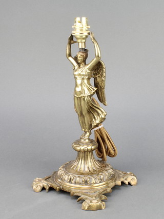 A Continental gilt metal table lamp base in the form of a standing winged female figure raised on square base with bracket feet 12" 