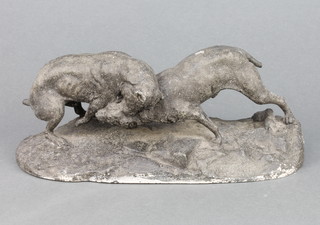 A 19th Century spelter figure group of 2 fighting dogs, raised on an oval base 9" (tail f) 