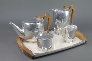 A 5 piece Picquot ware tea service comprising twin handled tray, teapot, cream jug, hot water jug and sucrier 