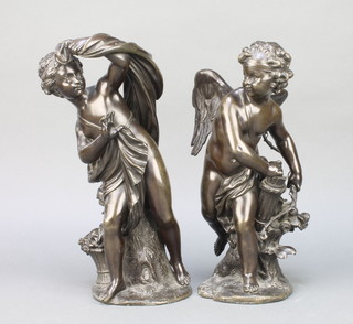 A pair of 19th Century Continental bronze figures of a standing angel with bow and quiver and a standing robed lady, both on rustic bases 12" 
