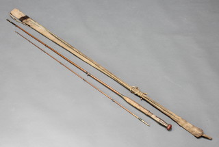 An Alcocks 7'9" split cane trout fishing rod with original cloth bag