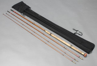An Edwardian Hardy 14' split cane salmon fishing rod with 2 tips in a cloth bag 
