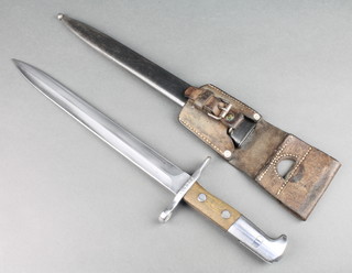 A 1918 patent Swiss Elsener Schwyz bayonet with 12" double blade, stamped Elsener Schwyz Victoria, the cross bar marked 217739 complete with scabbard and leather frog 