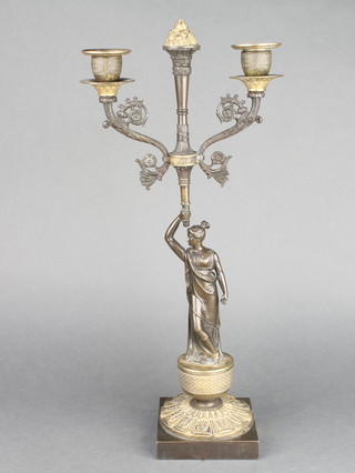 An Empire style bronze twin light candelabrum supported by a classical lady raised on a square base 16 1/2" x 4" with detachable sconces 