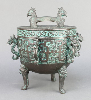 A Chinese bronzed finished ice bucket in the form of a censor raised on paw feet 8" x 8" 