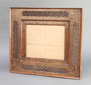 A 19th Century Indian pierced and brass inlaid hardwood photograph frame 15 1/2" x 17 1/2", missing some brass inlay 