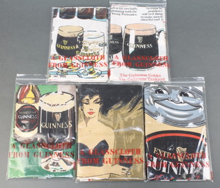 5 vintage Guinness tea cloths - Famous Glasses, Guinness at Home, Every Girl Should Have a Little Black Drink, There's No Place Like Home and How to Play Guinness,  all contained in polythene bags marked A glasscloth from Guinness