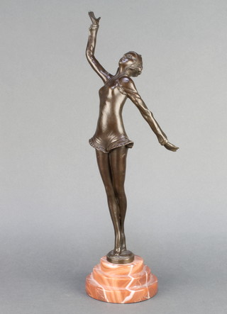 An Art Deco style bronze figure of a standing lady raised on stepped socle pink veined marble base 15" 