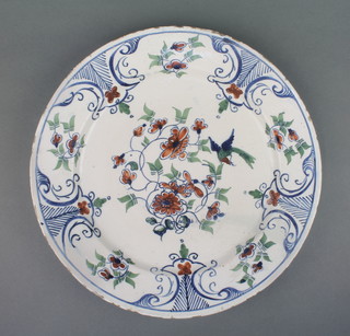 An 18th Century English Delft polychrome plate decorated with stylised flowers 13 1/2" 