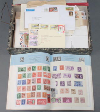 The Trusty stamp album of used world stamps together with a collection of first day covers and loose world stamps 